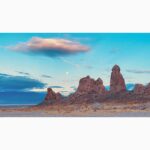 brown rock formation under blue sky